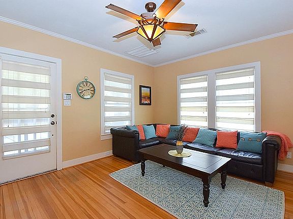 Great windows with upgraded window treatments in main living area of home that let in lots of natural light that gives warmth , while still maintaining privacy.