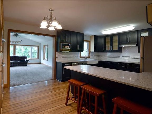 20x13 Kitchen has just been completely remodeled with high end appliances and quartz counter tops, and large island with so much