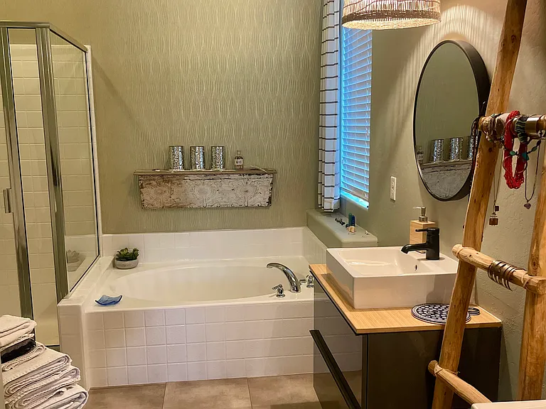 Primary Bath includes double sinks, soaking tub and shower and walk-in closet. Very private.