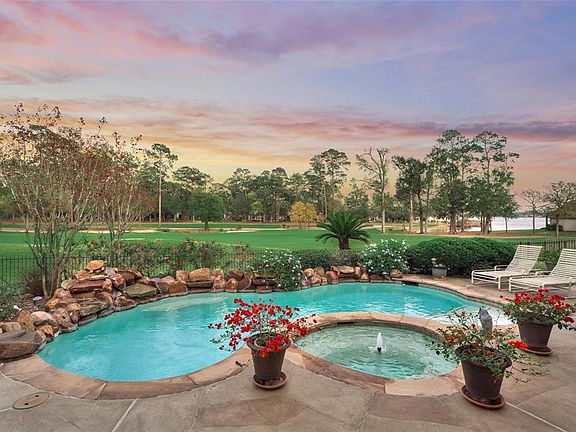 Roomy back yard with relaxing pool & spa. Rare far reaching golf views over 3 golf holes PLUS water views of Lake Conroe.
