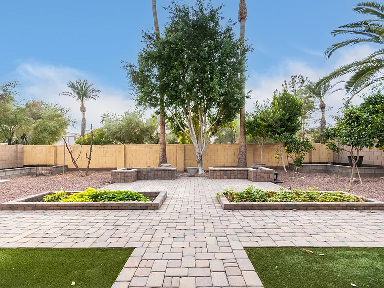 Private Backyard with Mature Trees and Lush Landscaping.