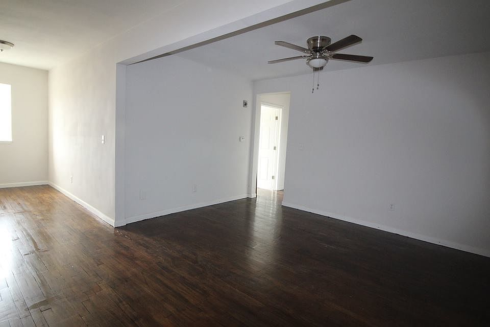 Large living room with an office or hobby nook.