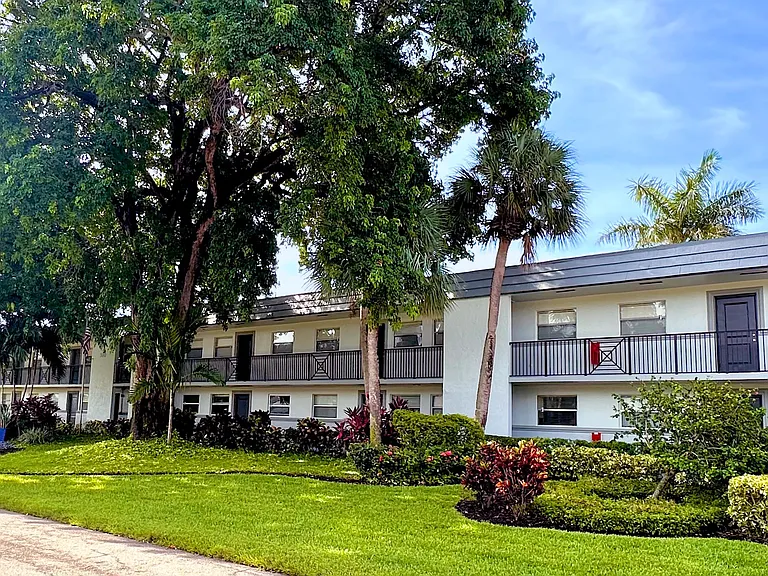 Surrounded by lush landscaping and mature trees, Boca Winds offers a perfect blend of nature and modern amenities in our vibrant community.