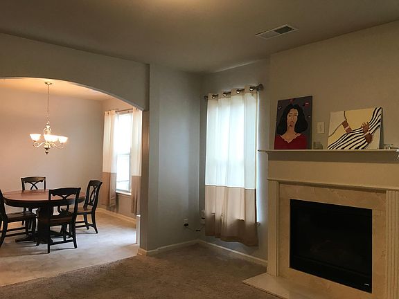 Paintings on mantel were given by previous tenant.