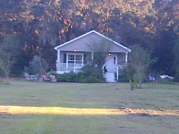 Majestic oaks in back.