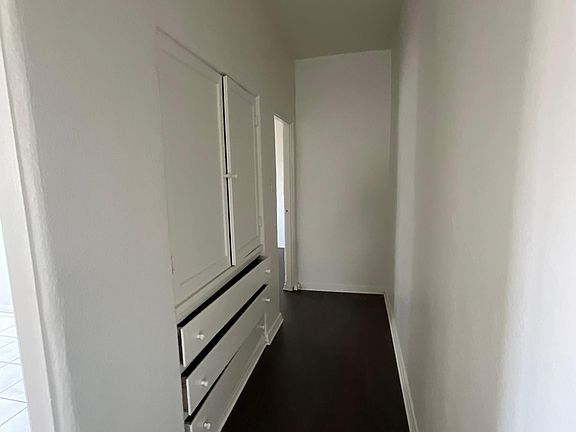 Hallway, lots of cupboards and drawers