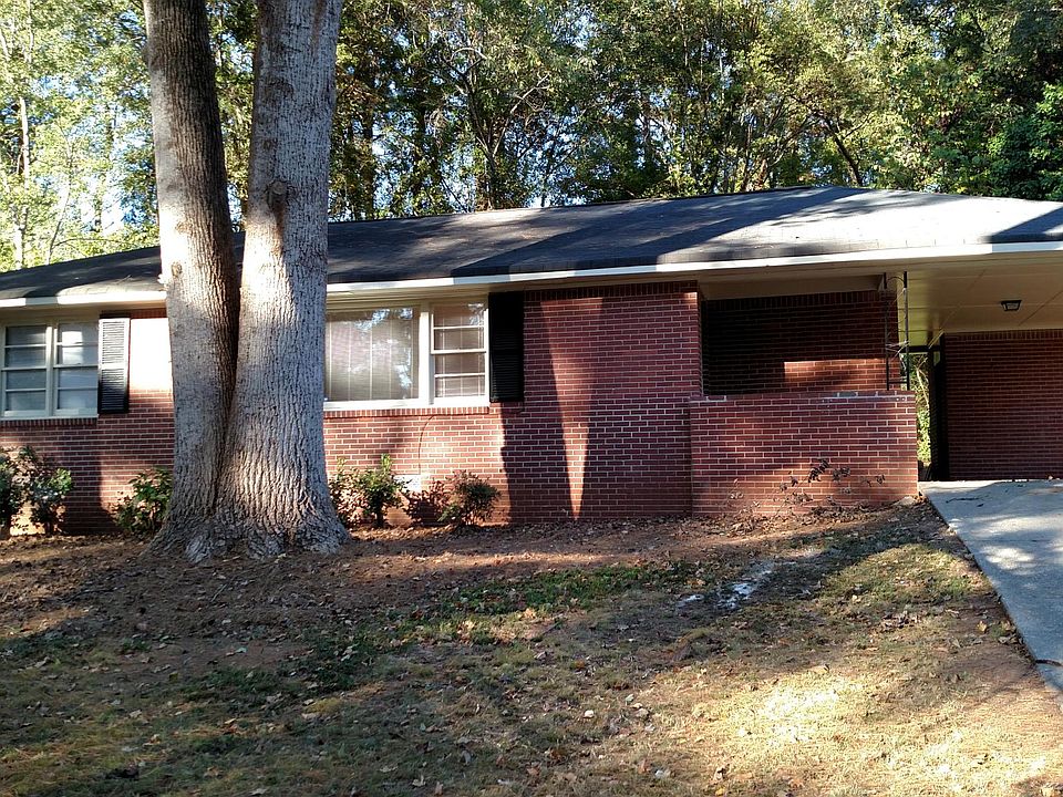 Front of the house with a covered carport