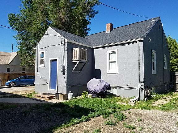 exterior with large yard. this only shows a portion of the yard. Yard is fenced on all sides but large gate to street is open