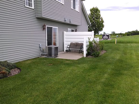 Private outdoor patio with large grassy area