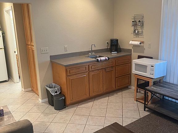 small kitchen with an electric burner and microwave
includes:
-utensils
-pots and pans
-cutting board