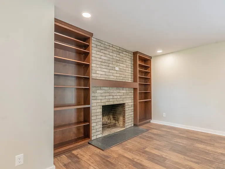 Fireplace #1. Built-in Bookcases, prepared for TV above Mantel