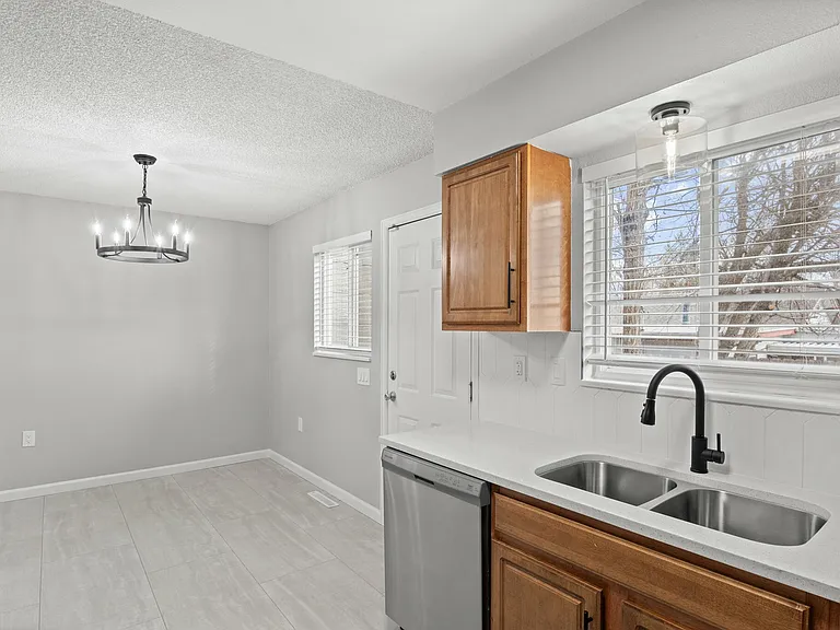 Embrace modern living with this airy kitchen, perfect for culinary enthusiasts and home gatherings. Embrace modern living with this airy kitchen, perfect for culinary enthusiasts and home gatherings.