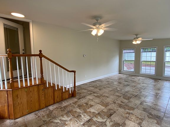 Sunroom w/ 2-Clg Fans & Stairs to Main Level