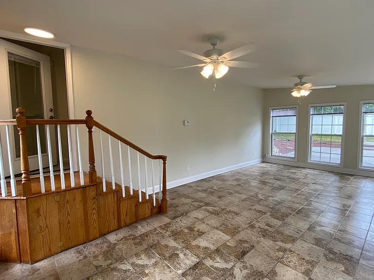 Sunroom w/ 2-Clg Fans & Stairs to Main Level