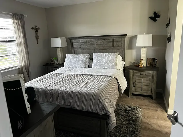 Master bedroom overlooking golf course. Off to the right is the ensuite with closet, sink, and changing area.