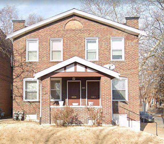 Front doors have been painted black. 2nd floor door is on the left.