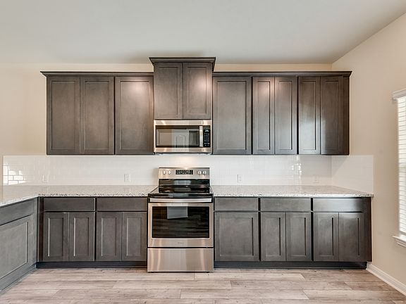 The kitchen comes with a full suite of stainless steel appliances.