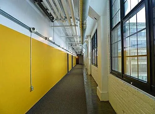This building is quirky and artsy and fun. Close to light rail. Several dining options on first floor of building, as well as a grocery store directly across the street.