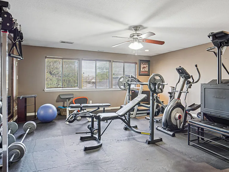 Game room currently used as a home gym