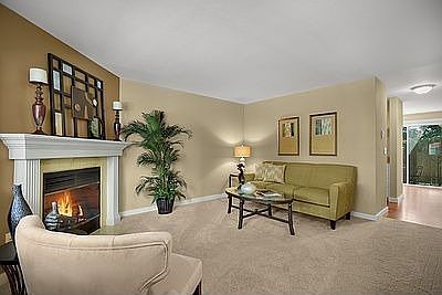 Living room w/ elegant fireplace mantel