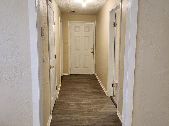 Hallway to bedroom, bath room, wash room and backyard.