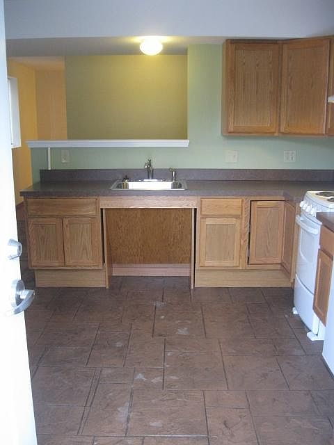 Living area/kitchen, includes stove and refrigerator