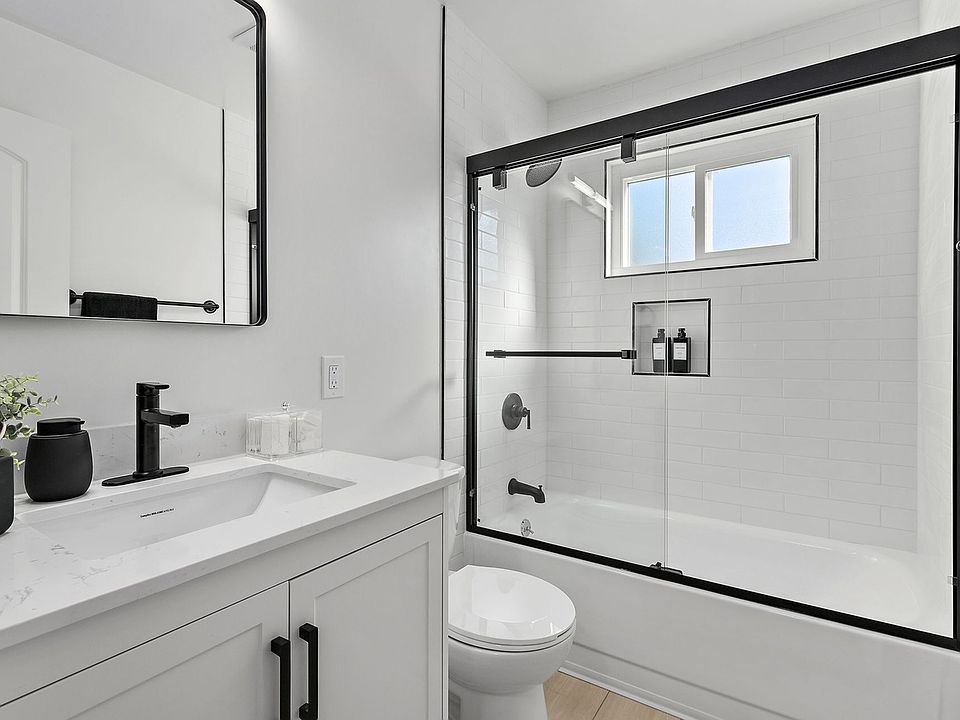 Modern tiled bathroom featuring sleek finishes, updated fixtures, and a fresh, contemporary look designed for comfort and style.