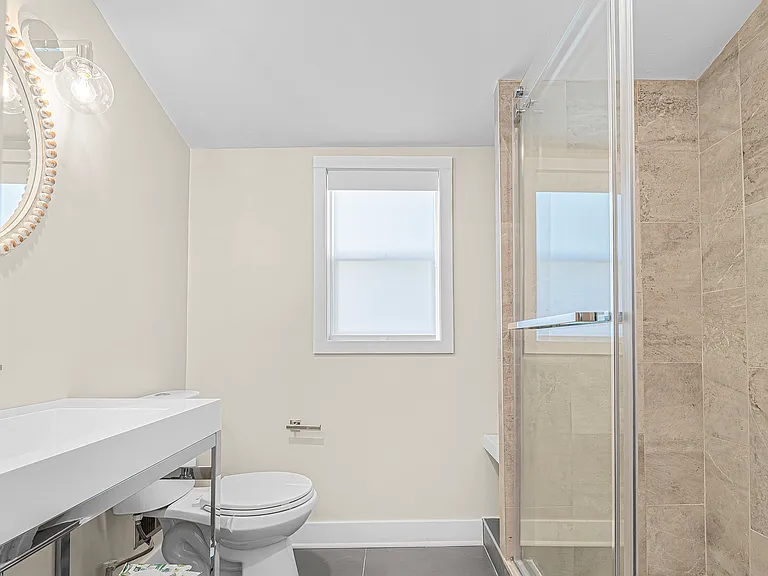 Beautifully appointed bathroom with walk-in shower, contemporary features
