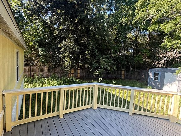 Large deck right off the family room and close to the kitchen. Fenced in Backyard