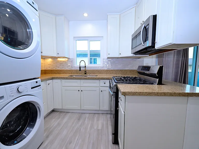 fully upgraded kitchen and in-unit laundry