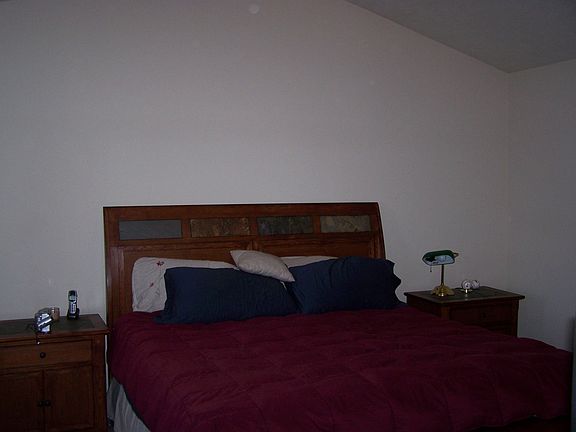 Master suite with vaulted ceiling