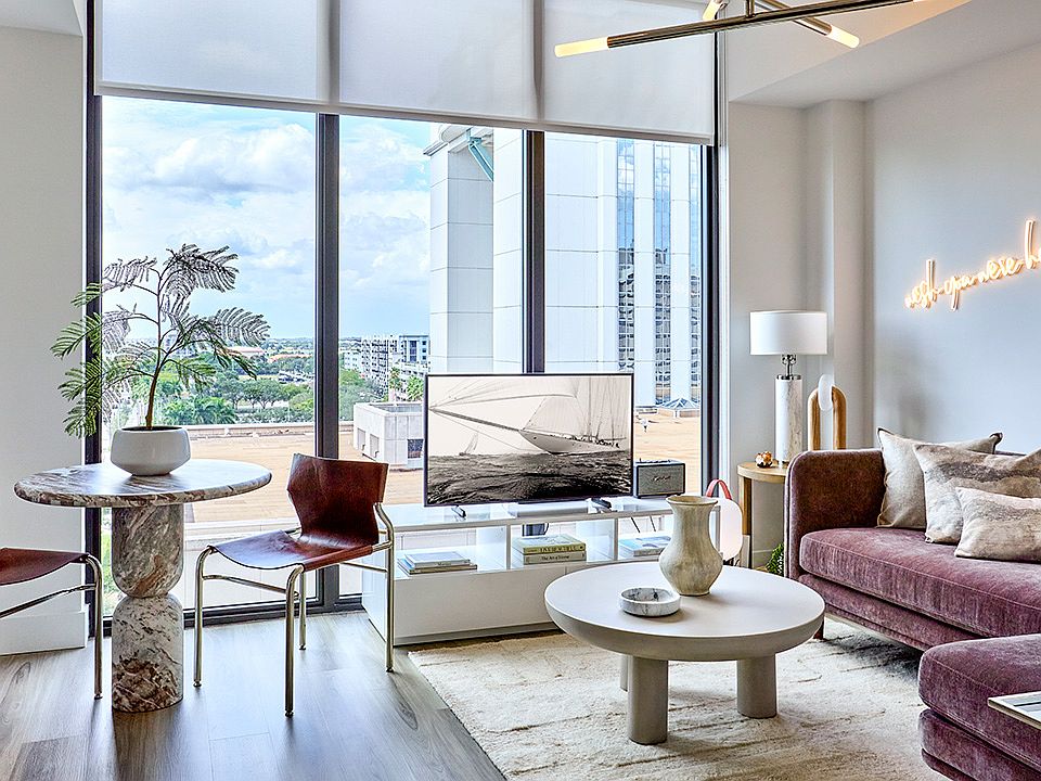 Apartment Living Room with Floor-to-Ceiling Windows and Wood Style Flooring
