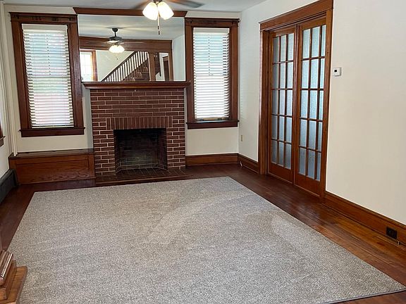 Living room with pocket doors closing off to dinning room