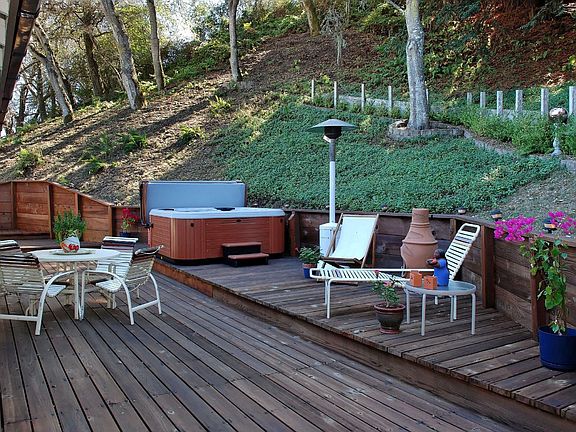 lots of decks for enjoying the outdoors,brand new hot tub!