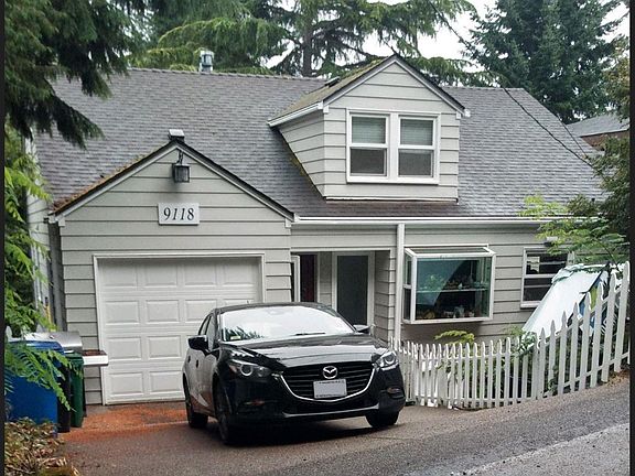 Front of house with garage, and driveway parking