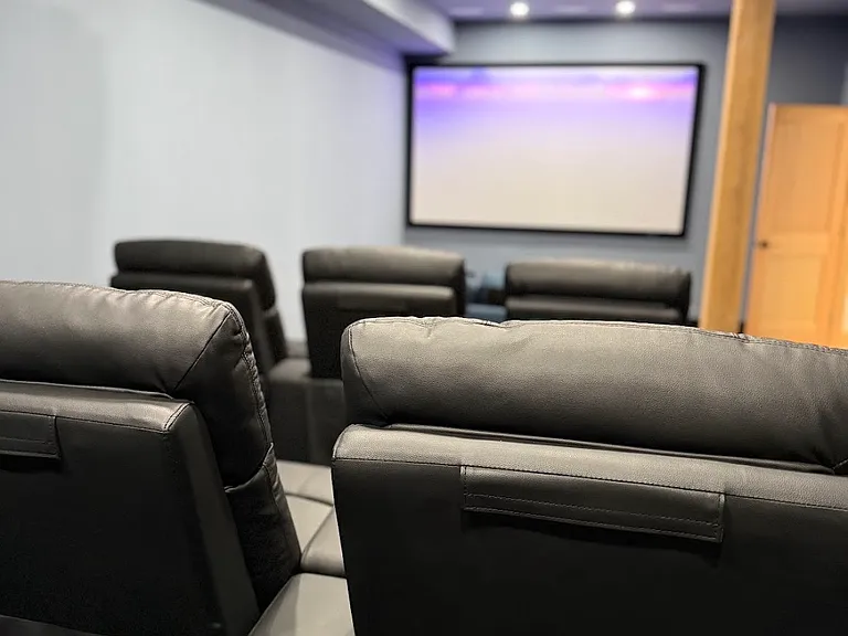 The theater room seats twelve.