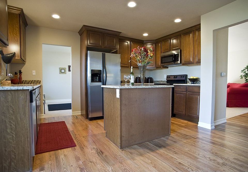 Kitchen has custom cabinets granite countertops & Stainless steel appliances