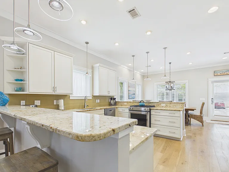 Large expansive kitchen with two bars and additional seating for entertaining