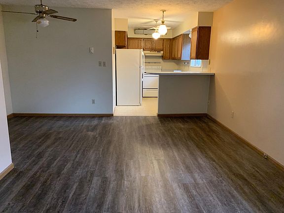 Spacious living room with completely new hardwood floor.