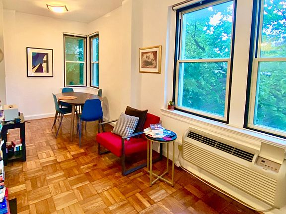 Dining area and windows face tons of greenery and tall trees. Like living in a treehouse!