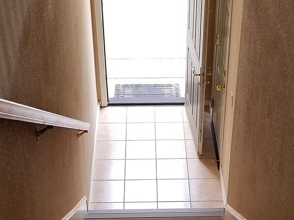 Front door; Door access to the attached garage