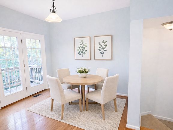 Eat-in nook has been virtually staged to illustrate the home's potential. Furnishings and decor are for visualization purposes only; the home is currently unfurnished.