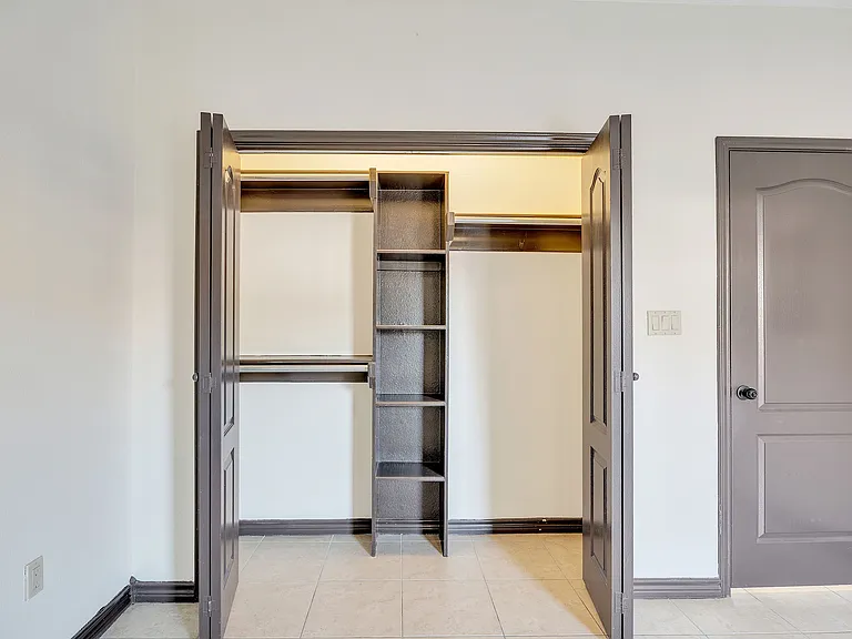 Unfurnished room at Merida Vista Apartments in Laredo, Texas, with a ceiling fan and a closet visible