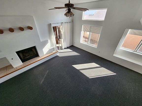 Living room is spacious, bright and airy with very high ceilings.