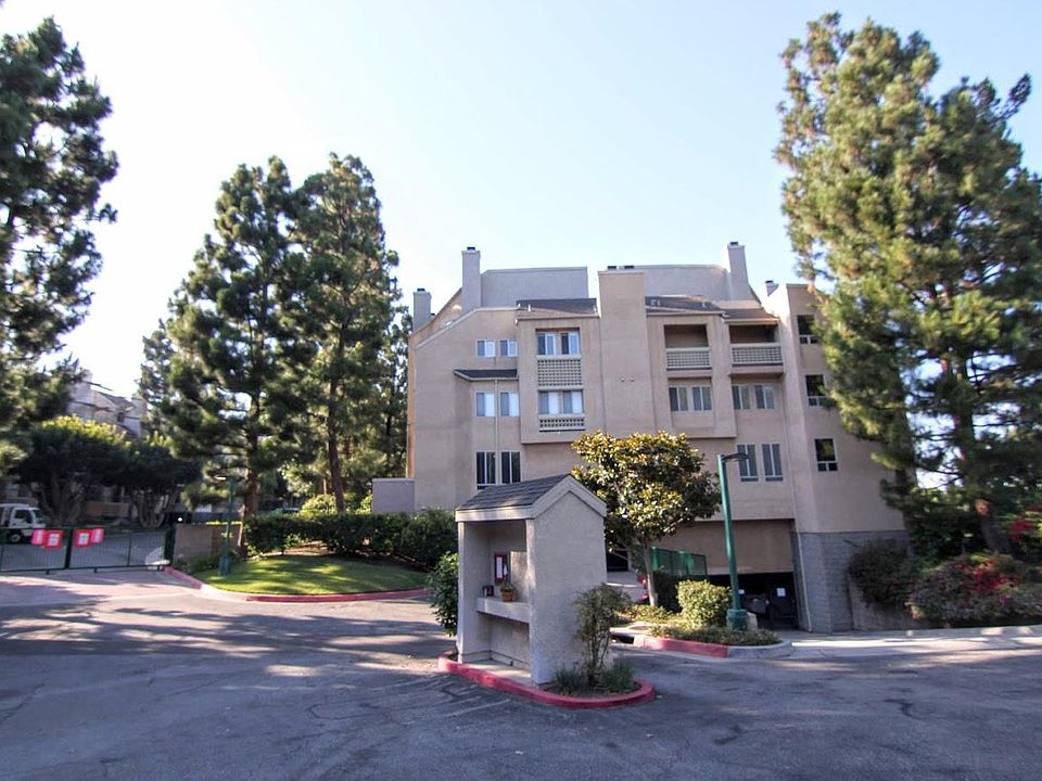 Garage entrances and front of building, and guest parking area. 949-422-0612
