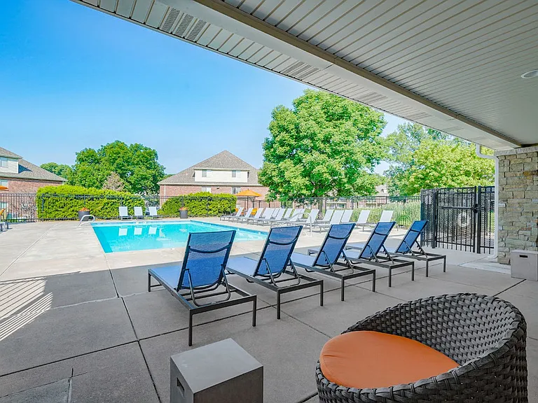 Poolside perfectionstretch out on a lounge chair, catch up with friends at the tables, or challenge them to a game of cornhole!