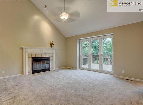 Fireplace and floor to ceiling new windows in great room