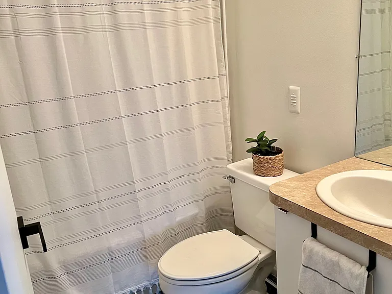 Upstairs bathroom with tub and shower
