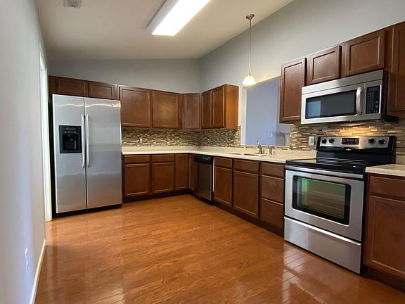 Updated kitchen with newer appliances, solid surface counters, and tile accents. Hardwood floors and fresh paint job.
