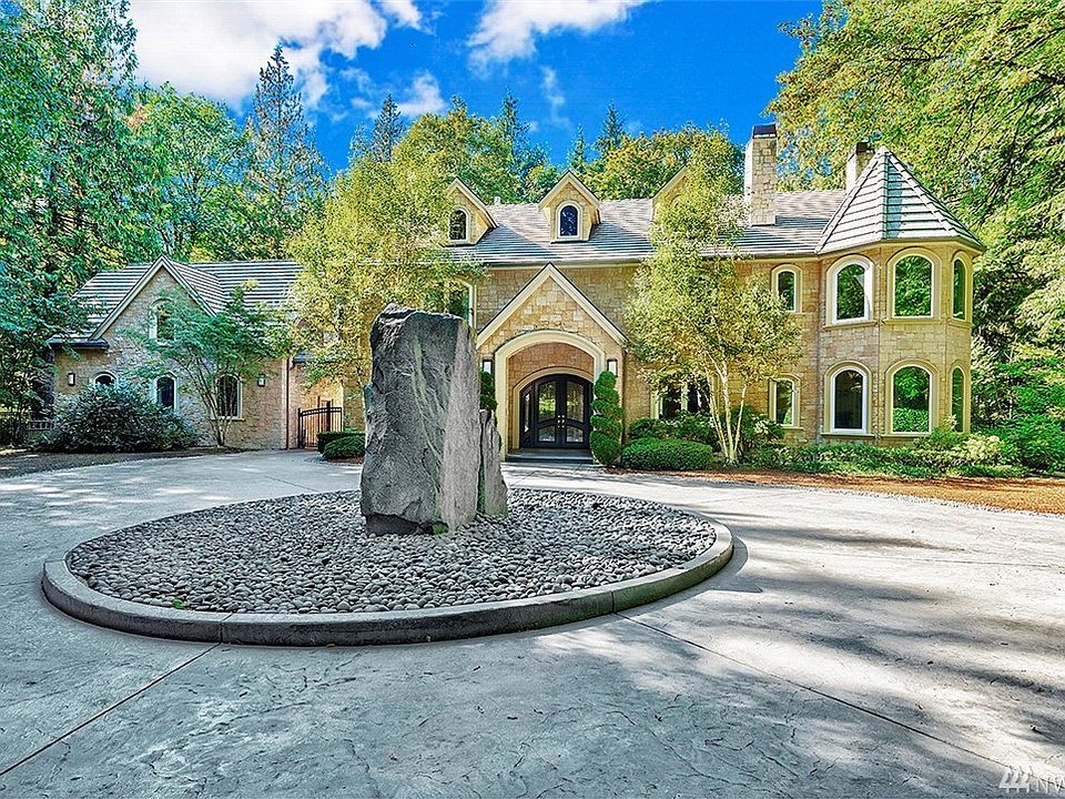 A long private road leads to a circular drive crowned by a granite slab fountain. Welcome home. You have arrived!